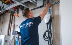Electrician from Matty James Electrician installing a Tesla wall charger at a home in Northern Beaches
